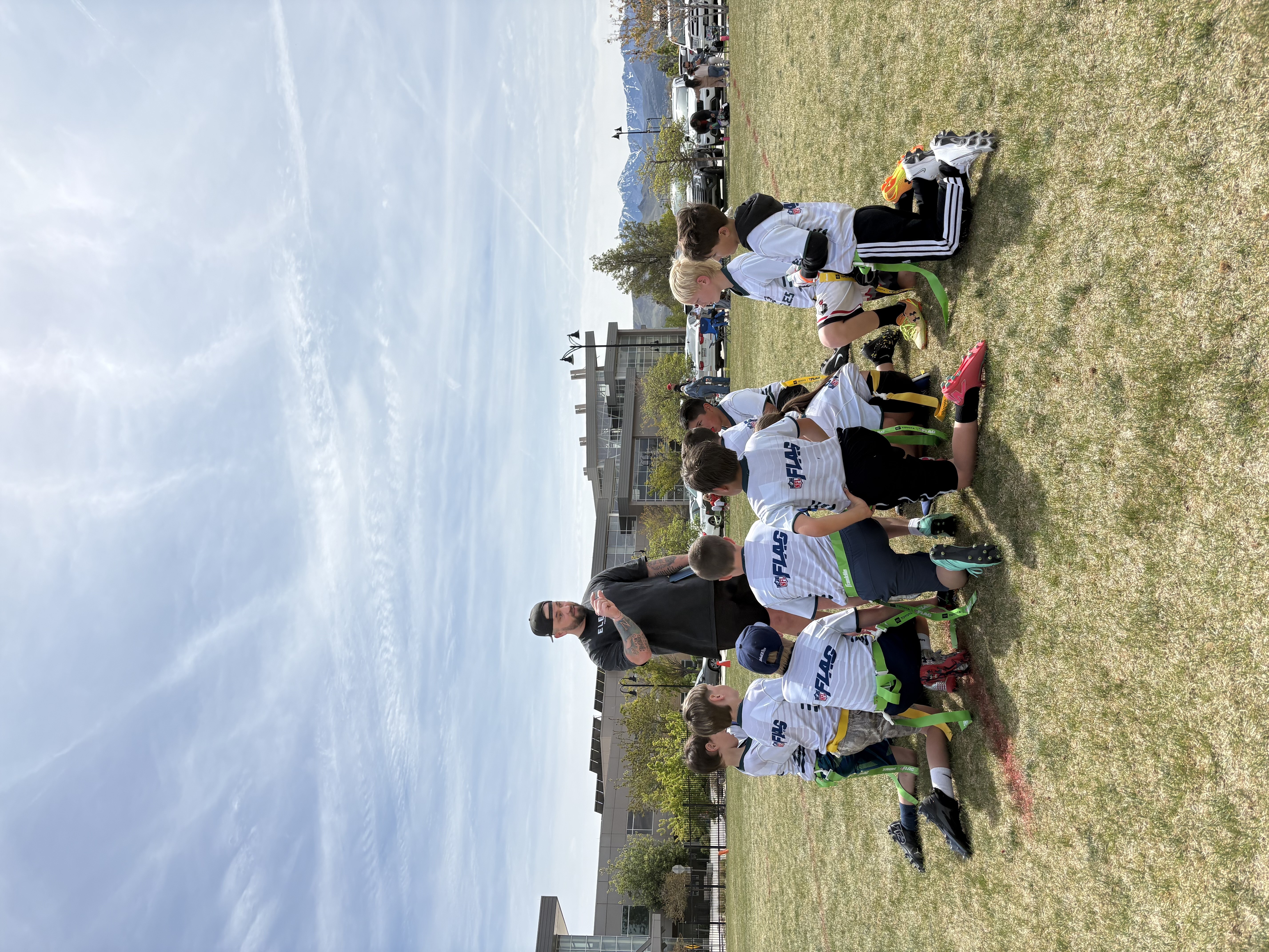 Coach Brett coaching flag football athletes